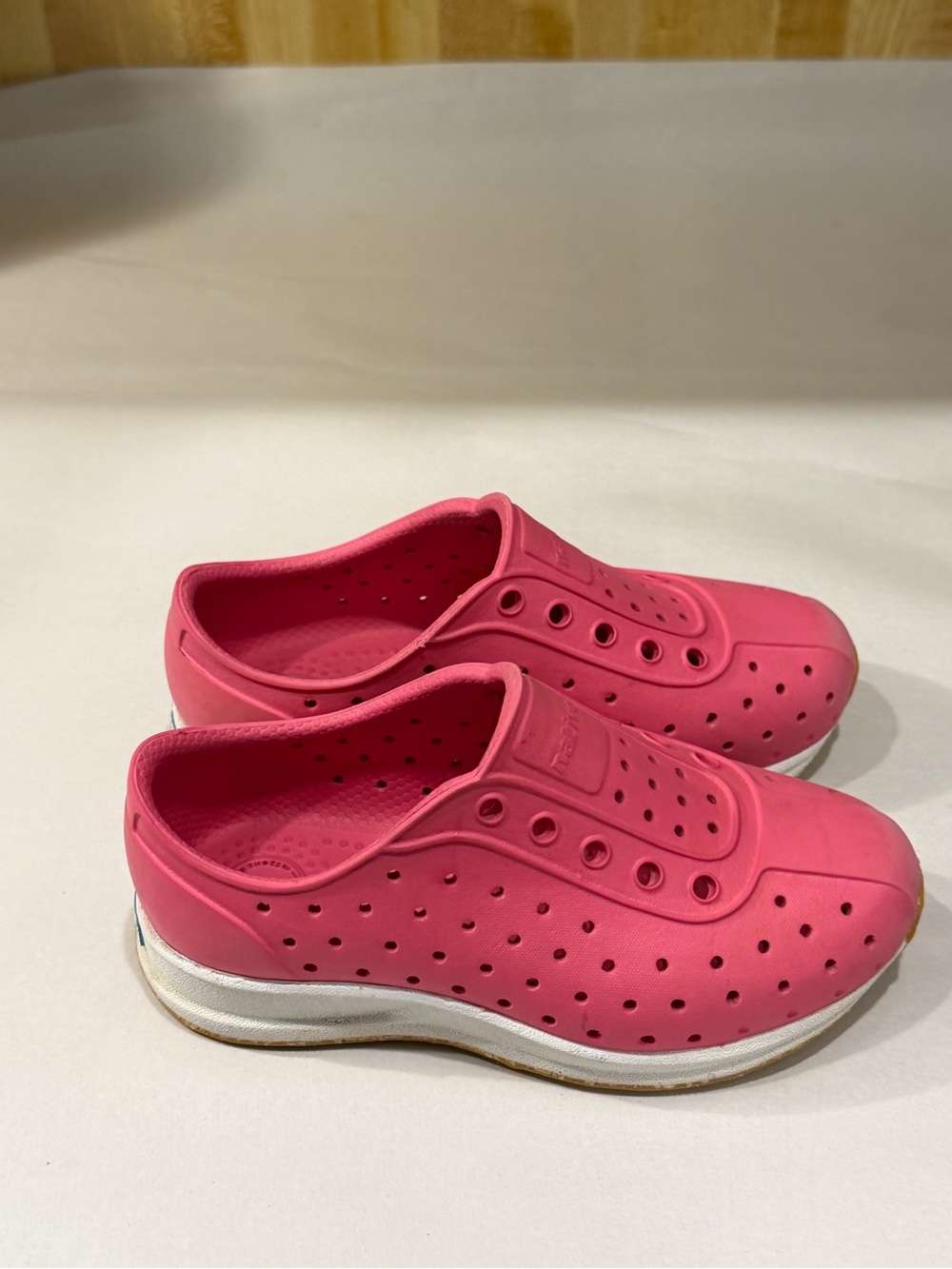 Native 
Pink Slip-On Perforated Foam Sneakers
